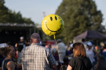 Smiley face yellow balloon at July Concert in Greenfield